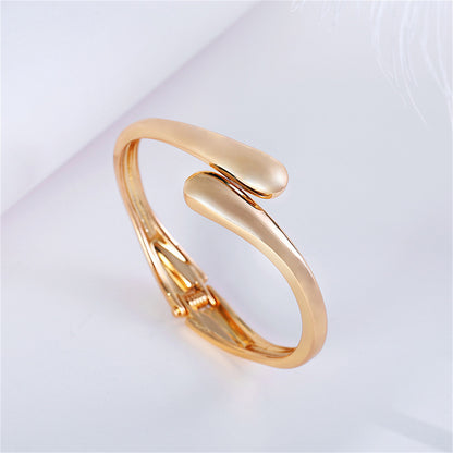 18K Gold-Plated Drop Bypass Hinge Bangle, gold bangle bracelet, botanical inspired, detail close-up