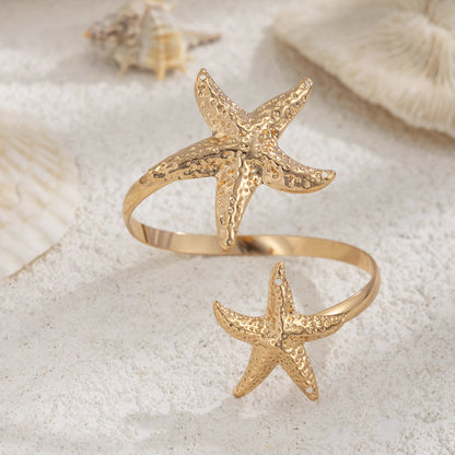 Goldtone Hammered Dual-Starfish Bypass Arm Cuff, dainty minimalist design, side view