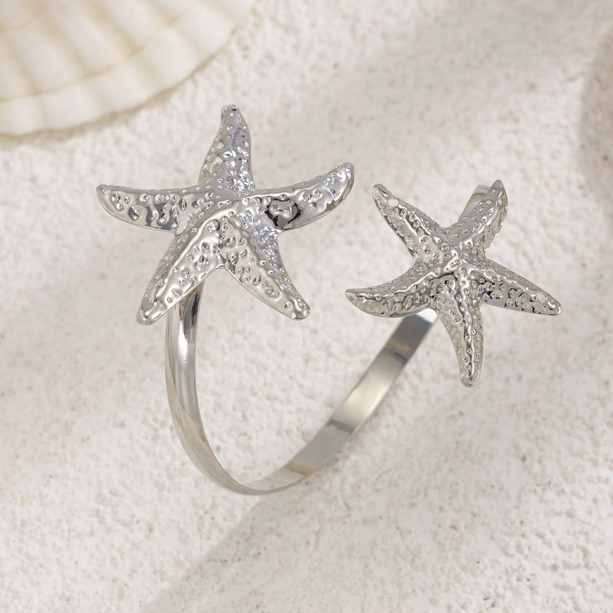 Silvertone Hammered Dual-Starfish Bypass Arm Cuff, vintage-inspired design, side view