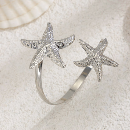 Silvertone Hammered Dual-Starfish Bypass Arm Cuff, vintage-inspired design, side view