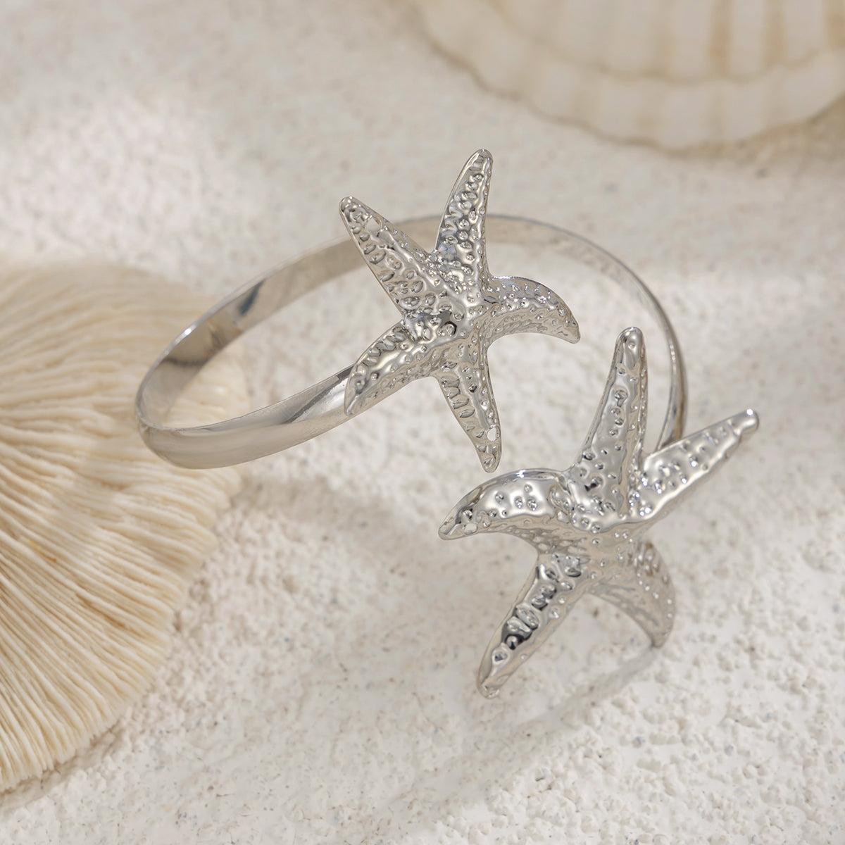 Silvertone Hammered Dual-Starfish Bypass Arm Cuff, vintage-inspired design, detail close-up