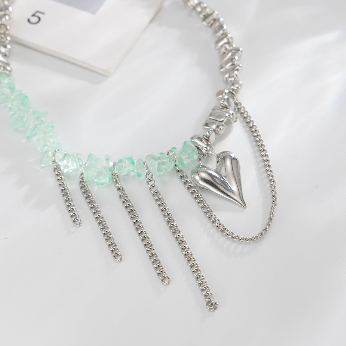 Light Green Acrylic and Silvertone Heart Pendant Tassel Necklace, botanical inspired, detail close-up