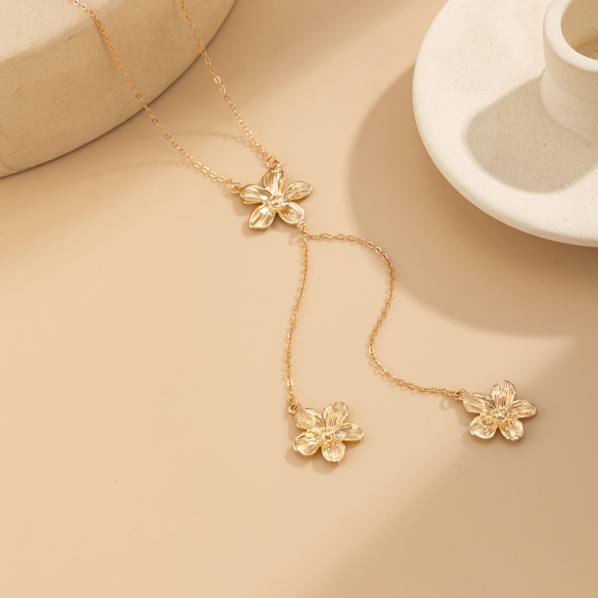 Goldtone Flower Tassel Pendant Necklace, botanical inspired, detail close-up
