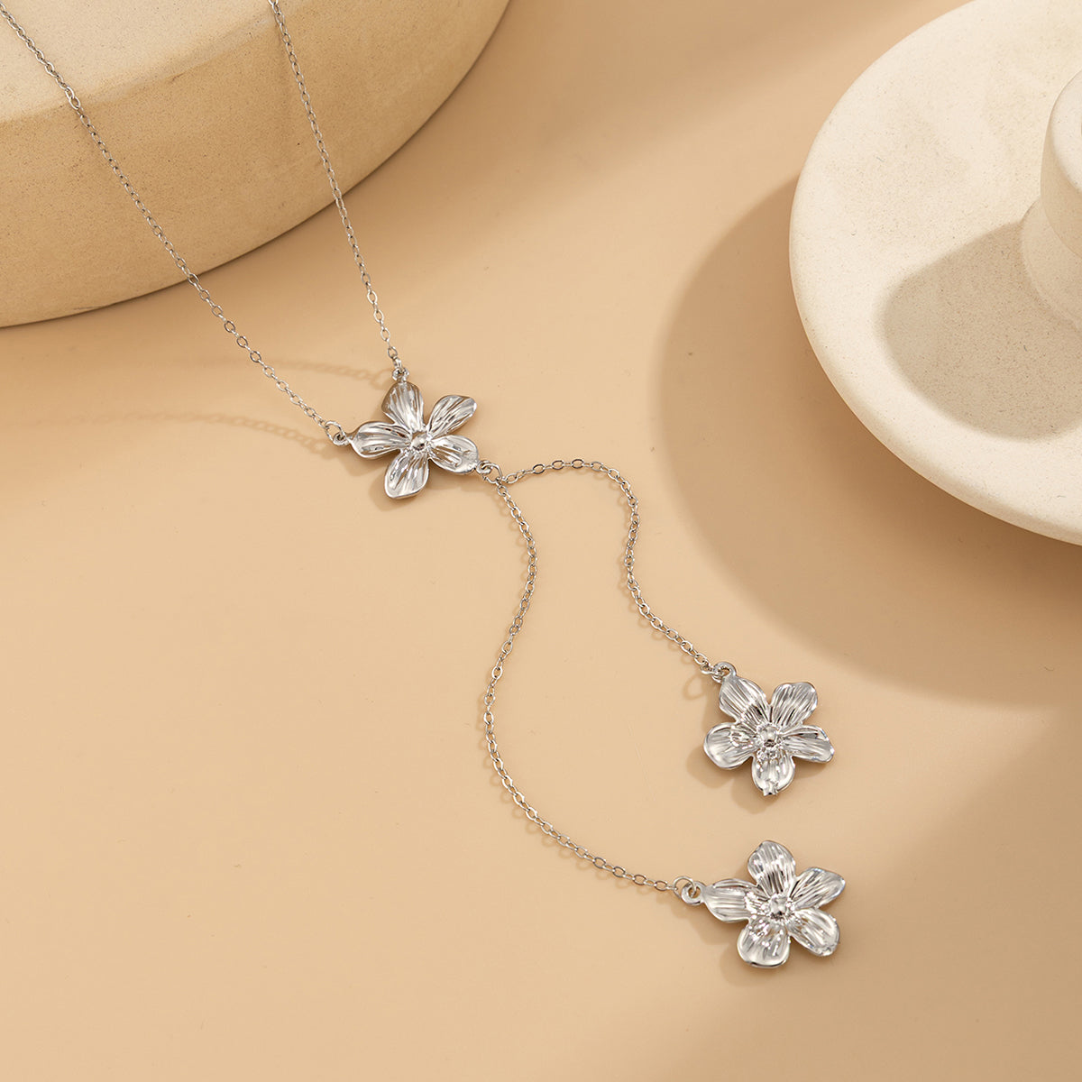 Silvertone Flower Tassel Pendant Necklace, vintage-inspired design, side view