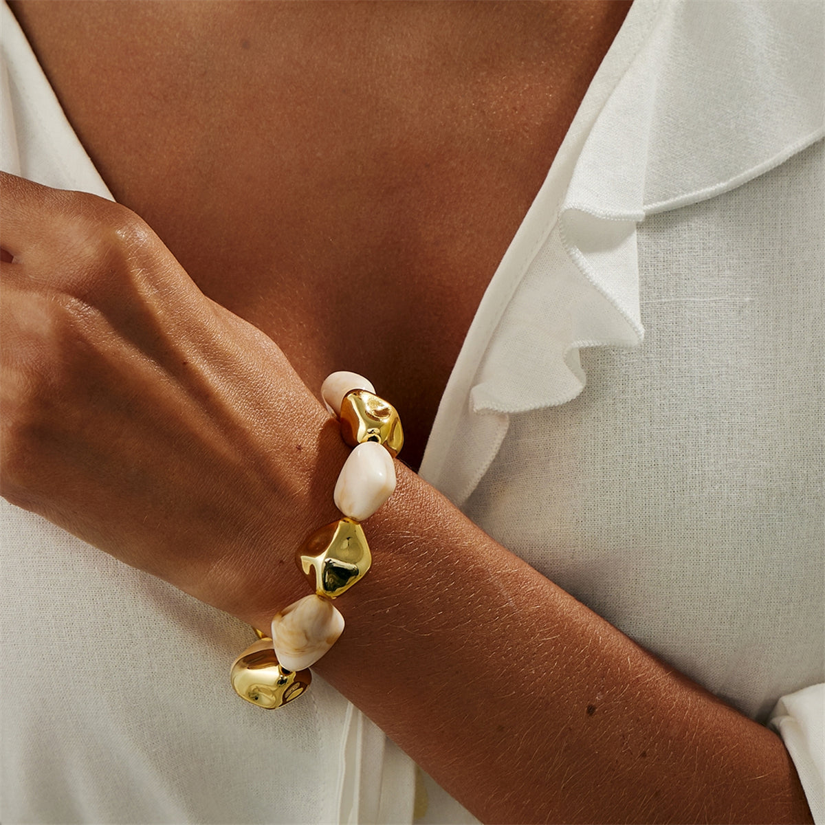 Beige Resin and Goldtone Irregular Beads Station Stretch Bracelet, dainty minimalist design, lifestyle look