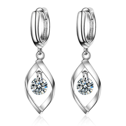 Crystal and Silver-Plated Twisted Drop Huggie Earrings, silver huggie earrings, vintage-inspired design, styled look