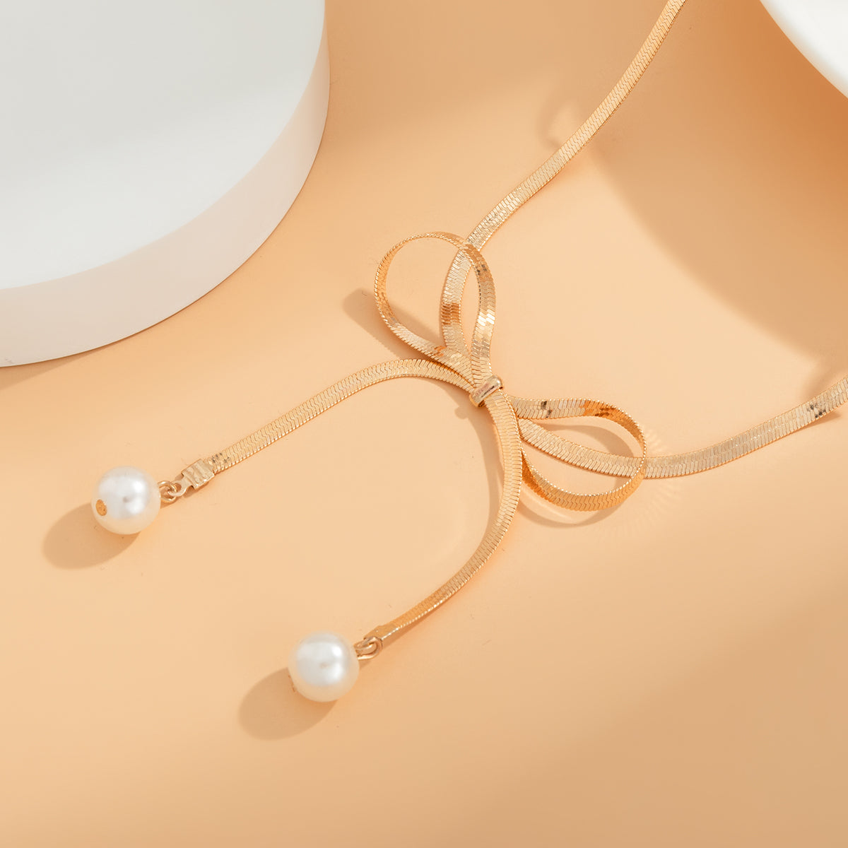 Pearl and 18K Gold-Plated Bow Choker Necklace, gold pendant necklace for women, dainty minimalist design, side view