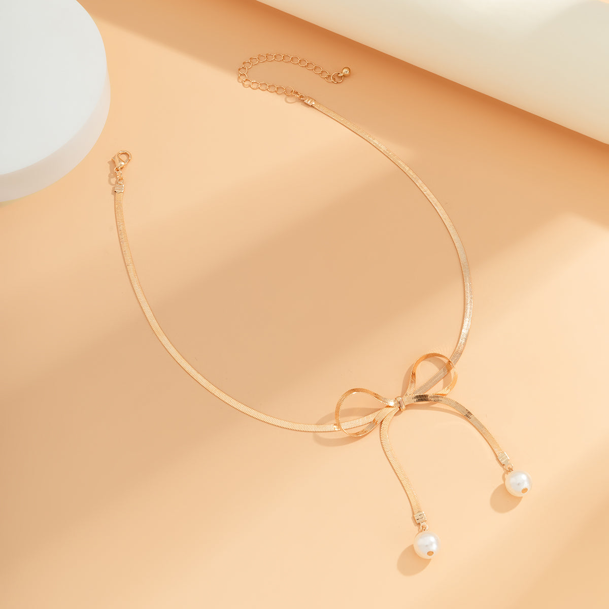 Pearl and 18K Gold-Plated Bow Choker Necklace, gold pendant necklace for women, dainty minimalist design, lifestyle look