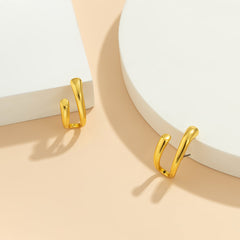 Stunning 18K gold-plated earrings with a chic curved shape, perfect for adding a touch of elegance to your outfit.