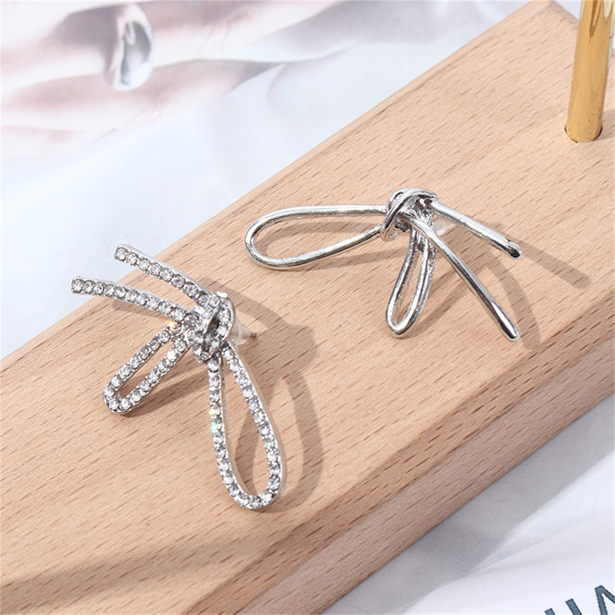 Cubic Zirconia and Silver-Plated Knot Stud Earrings, silver stud earrings for women, dainty minimalist design, front view