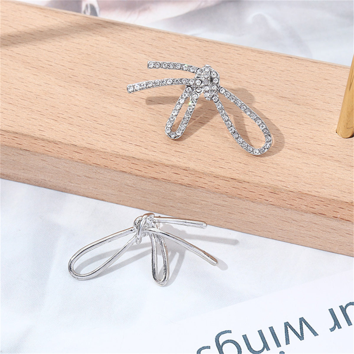 Cubic Zirconia and Silver-Plated Knot Stud Earrings, silver stud earrings for women, dainty minimalist design, side view
