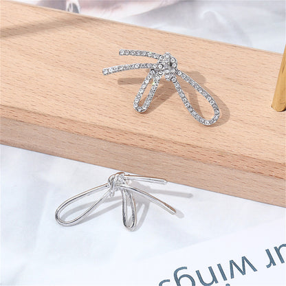 Cubic Zirconia and Silver-Plated Knot Stud Earrings, silver stud earrings for women, dainty minimalist design, side view