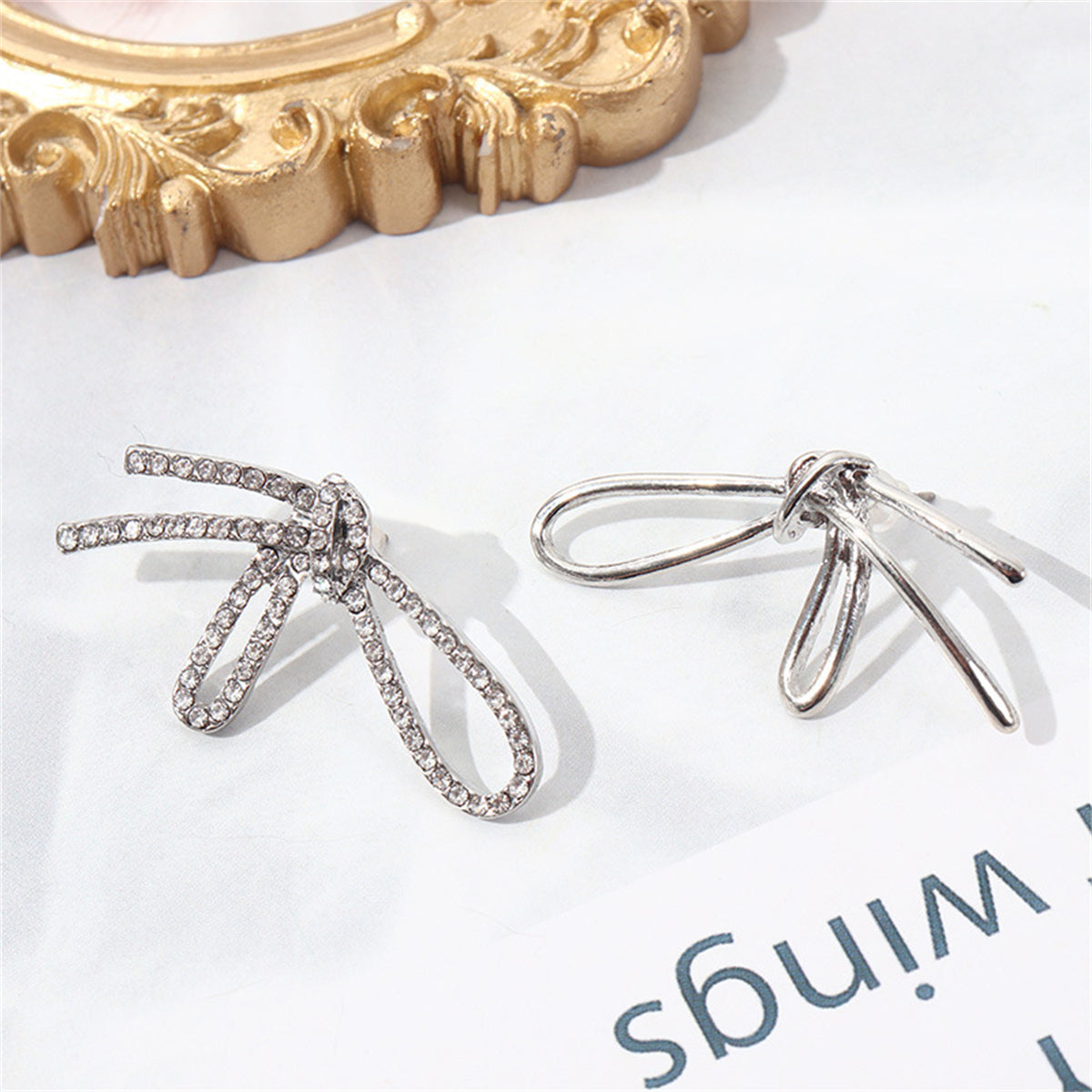 Cubic Zirconia and Silver-Plated Knot Stud Earrings, silver stud earrings for women, detail close-up