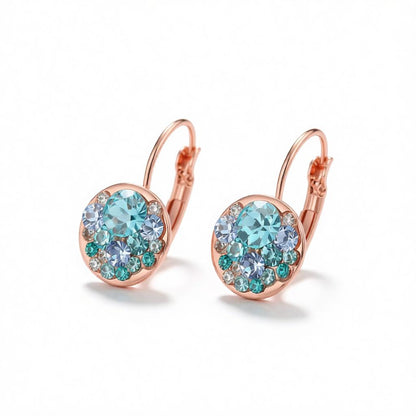 Blue Cubic Zirconia and 18K Rose Gold-Plated Huggie Earrings, rose gold huggie earrings, dainty minimalist design, side view