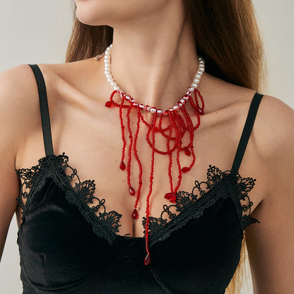Red Acrylic and Enamel Pearl Silvertone Tassel Necklace, dainty minimalist design, lifestyle look