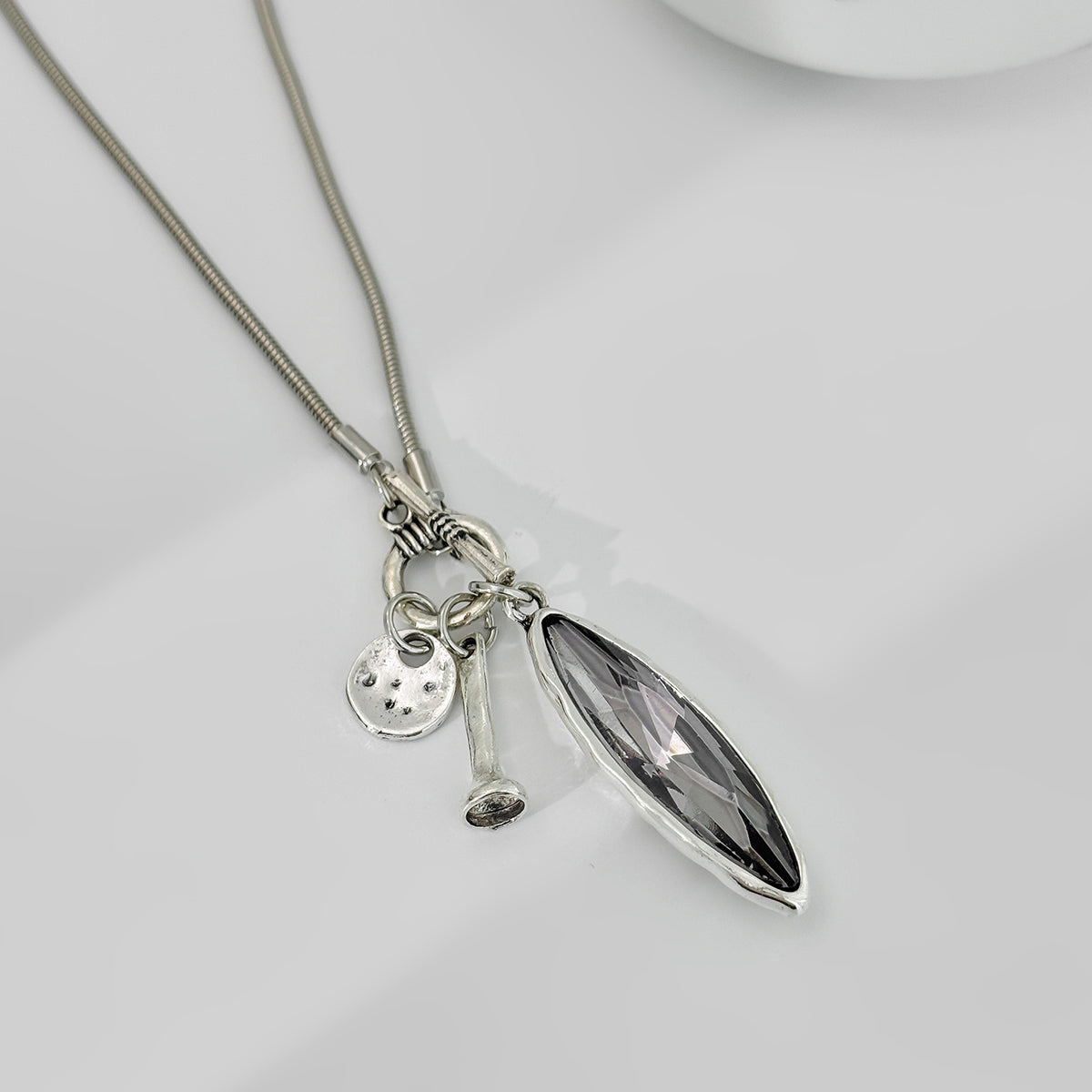 Marquise Crystal and Silvetone Pendant Toggle Necklace, botanical inspired, side view