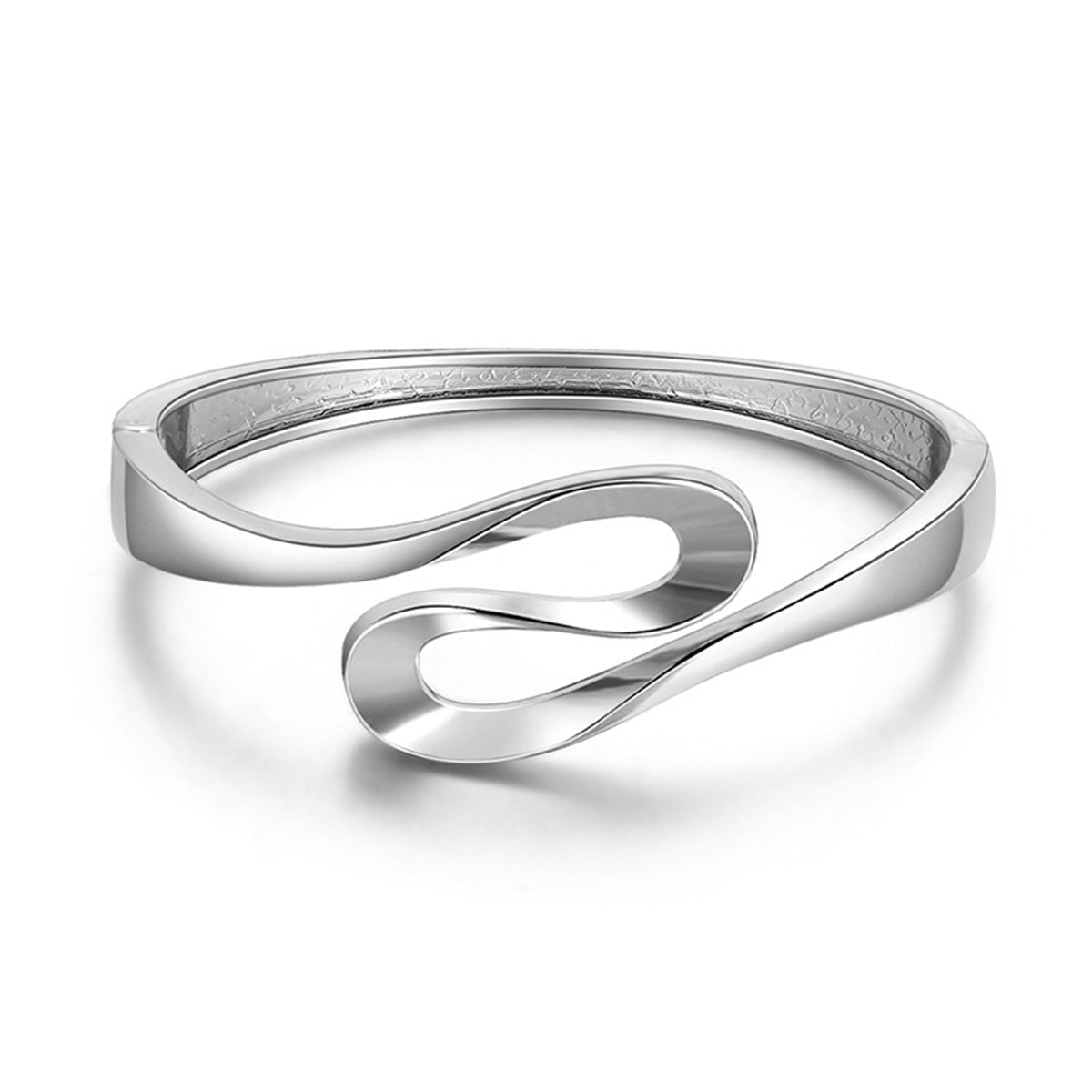 A silver-plated ribbon bangle featuring a sleek, curved design, elegantly showcasing its modern aesthetic.