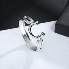 Elegant silver-plated saddle bangle showcasing a ring adorned with two side balls for added flair.