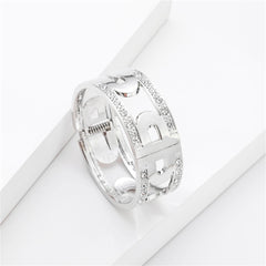 Elegant silver-plated bangle featuring diamonds on the sides, alongside a cubic zirconia and silver-plated lock bangle.