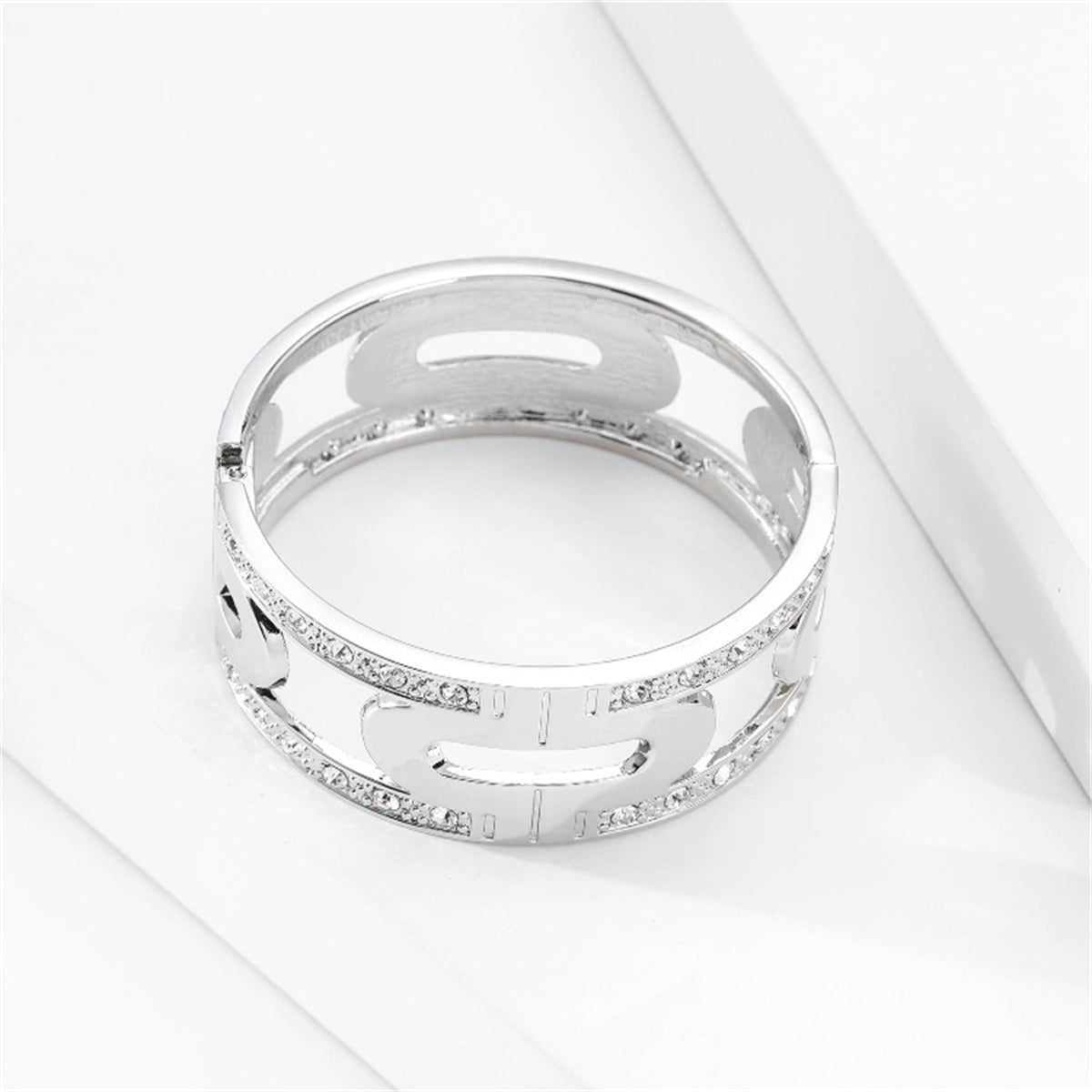 Silver-plated bangle embellished with side diamonds, accompanied by a cubic zirconia and silver-plated lock bangle.