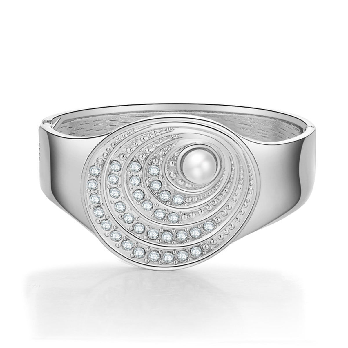 A silver bangle featuring a pearl and diamond design, complemented by a cubic zirconia and pearl silver-plated shell bangle.