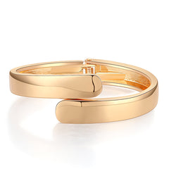 Stunning 18K gold-plated bangle bracelet with a unique bypass hinge design and two elegantly curved edges.