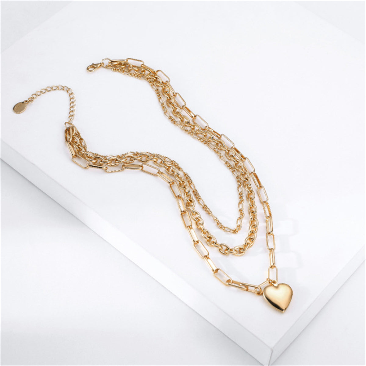 Beautifully crafted 18K gold-plated cable chain necklace adorned with a heart pendant, perfect for a stylish layered look.