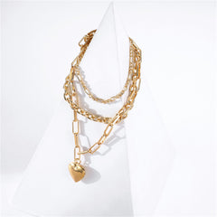 Chic 18K gold-plated necklace showcasing a heart charm, designed for layering and elevating your fashion statement.