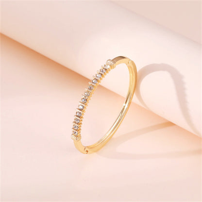 Cubic Zirconia and 18K Gold-Plated Hinged Bangle, gold bangle bracelet, vintage-inspired design, side view