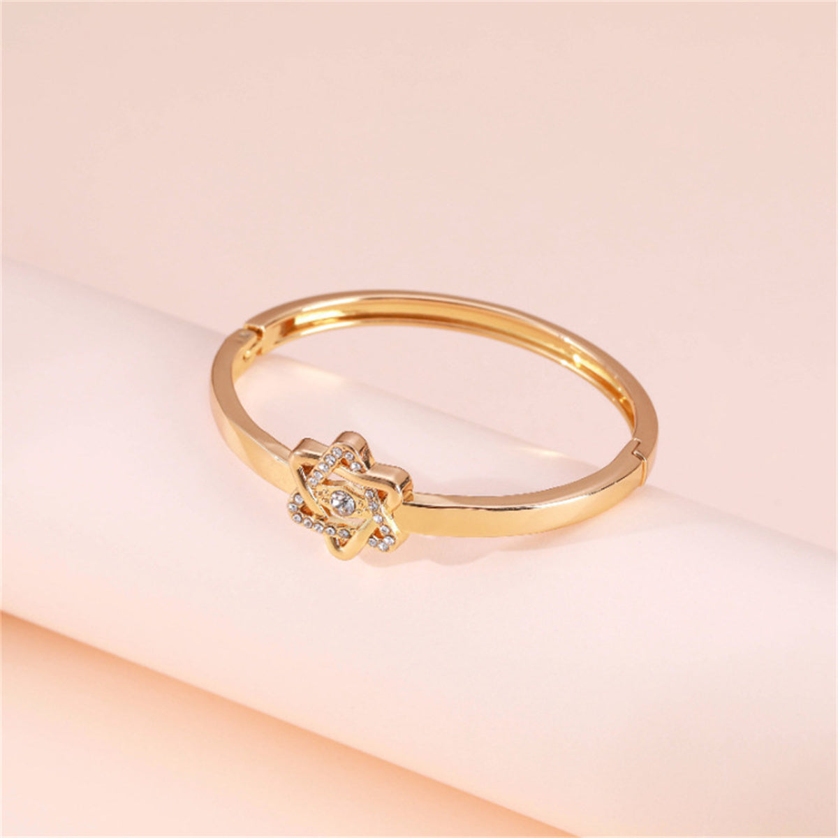 Cubic Zirconia and 18K Gold-Plated Flush-Set Openwork Star Hinge Bangle, gold bangle bracelet, botanical inspired, side view