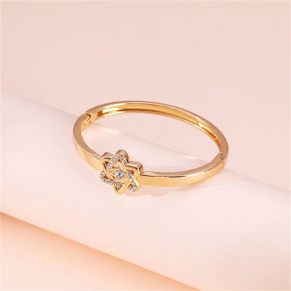 Cubic Zirconia and 18K Gold-Plated Flush-Set Openwork Star Hinge Bangle, gold bangle bracelet, botanical inspired, side view