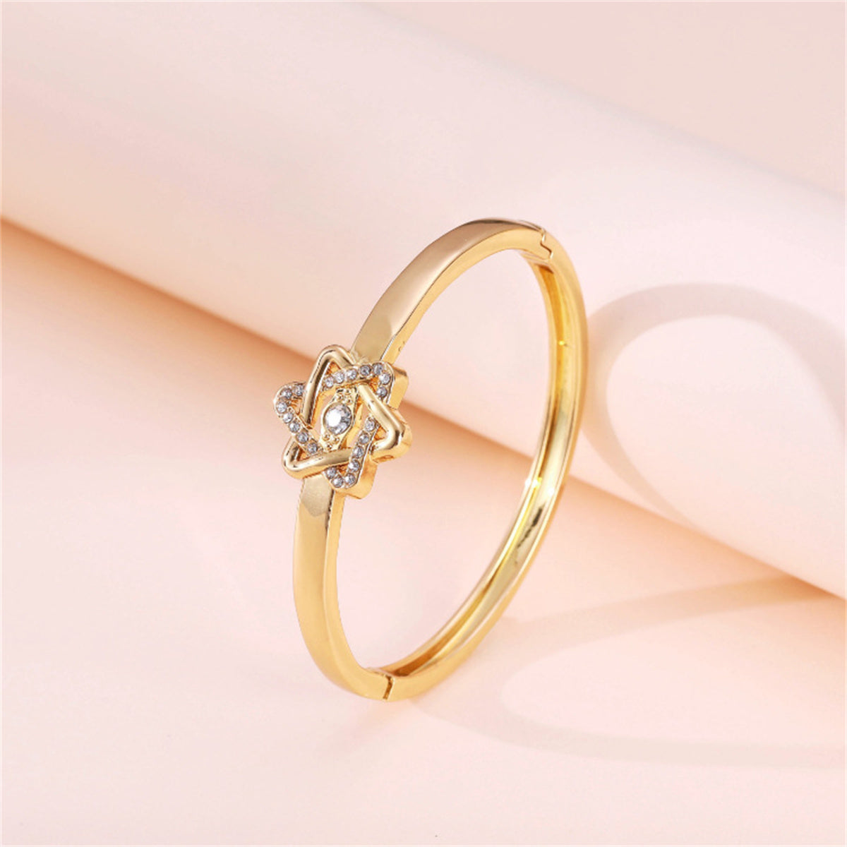 Cubic Zirconia and 18K Gold-Plated Flush-Set Openwork Star Hinge Bangle, gold bangle bracelet, detail close-up