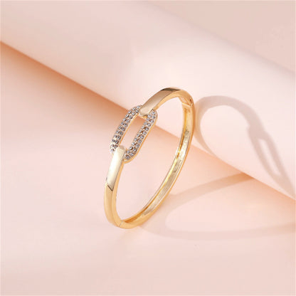 Cubic Zirconia and 18K Gold-Plated Oval Bangle, gold bangle bracelet, everyday style, detail close-up
