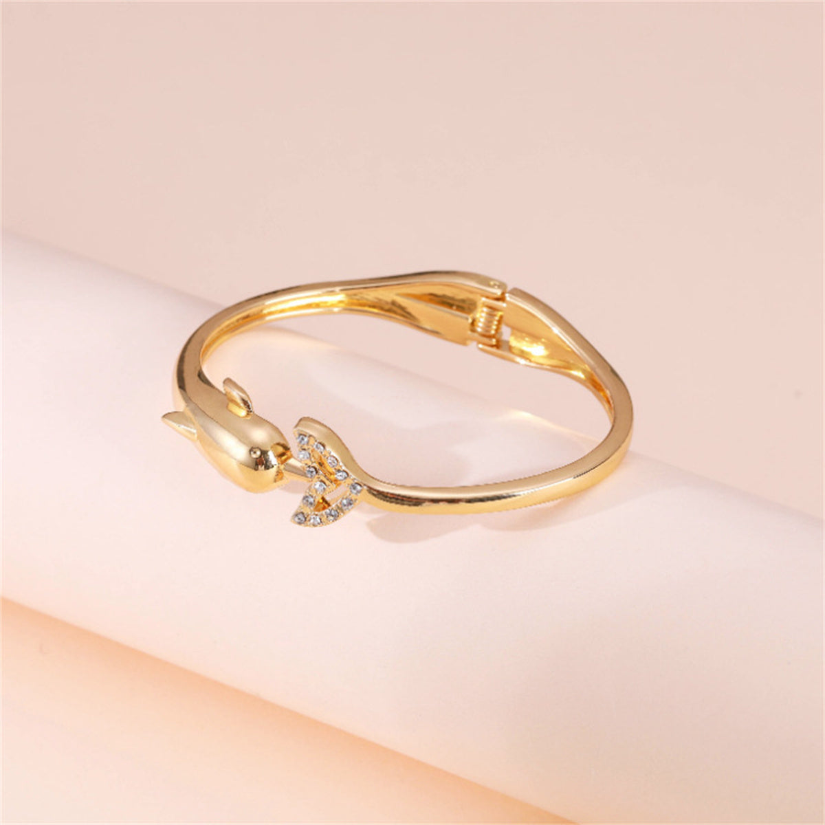 Cubic Zirconia and 18K Gold-Plated Openwork Dolphin Hinge Bangle, gold bangle bracelet, botanical inspired, detail close-up