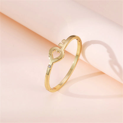Cubic Zirconia and 18K Gold-Plated Openwork Key Heart Hinge Bangle, gold bangle bracelet, everyday style, side view