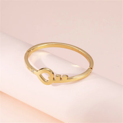Cubic Zirconia and 18K Gold-Plated Openwork Key Heart Hinge Bangle, gold bangle bracelet, everyday style, detail close-up