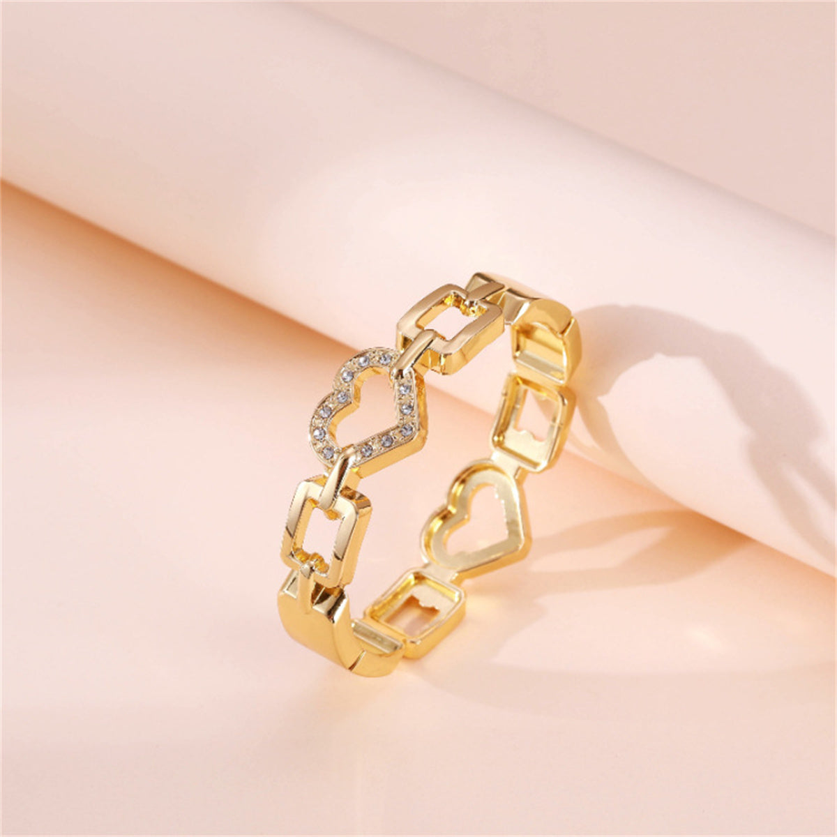 Cubic Zirconia and 18K Gold-Plated Heart Charm Bangle, gold bangle bracelet, botanical inspired, side view