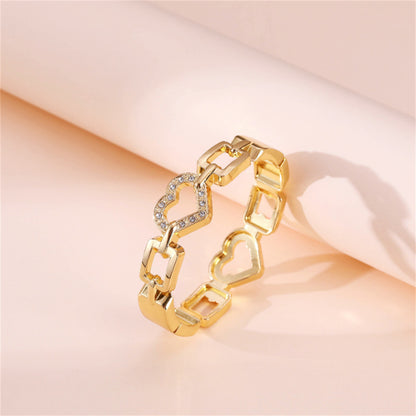 Cubic Zirconia and 18K Gold-Plated Heart Charm Bangle, gold bangle bracelet, botanical inspired, side view