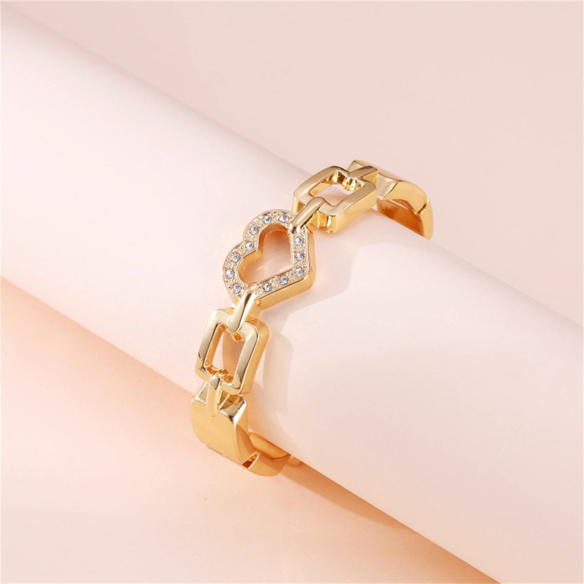 Cubic Zirconia and 18K Gold-Plated Heart Charm Bangle, gold bangle bracelet, botanical inspired, detail close-up