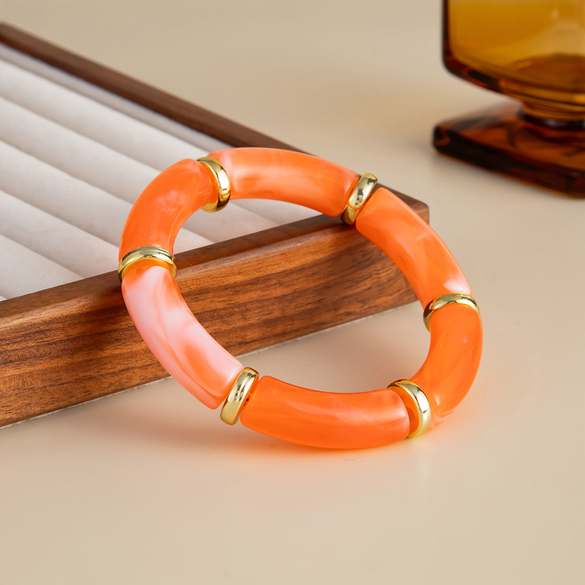 Orange Resin and Goldtone Sequin Joint Stretch Bracelet, dainty minimalist design, side view