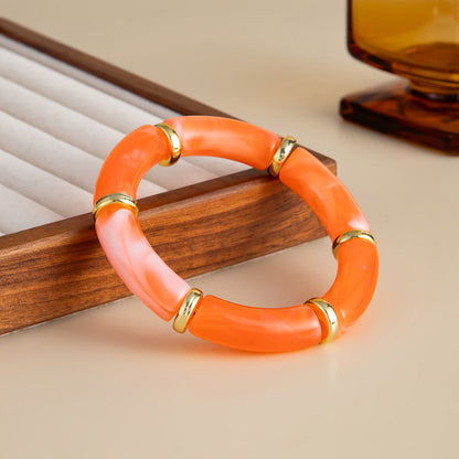 Orange Resin and Goldtone Sequin Joint Stretch Bracelet, dainty minimalist design, side view