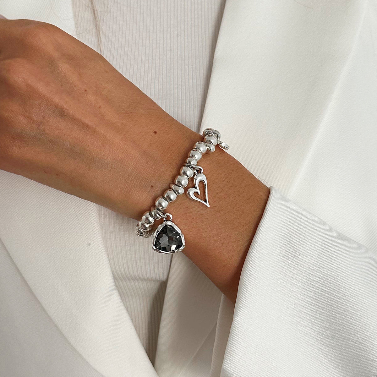 Crystal and Silvertone Open Heart Charm Stretch Bracelet, silver bracelet for women, vintage-inspired design, lifestyle look