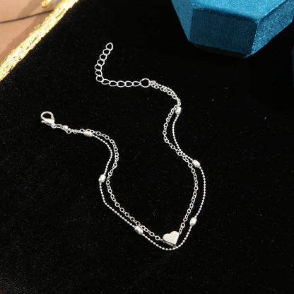 Silver-Plated Heart Charm Anklet and Station Anklet Set, silver anklet bracelet, botanical inspired, side view