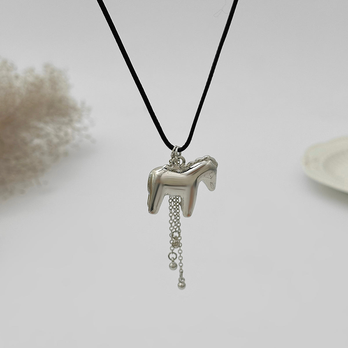 Black Polyster and Silvertone Horse Tassel Pendant Necklace, dainty minimalist design, detail close-up