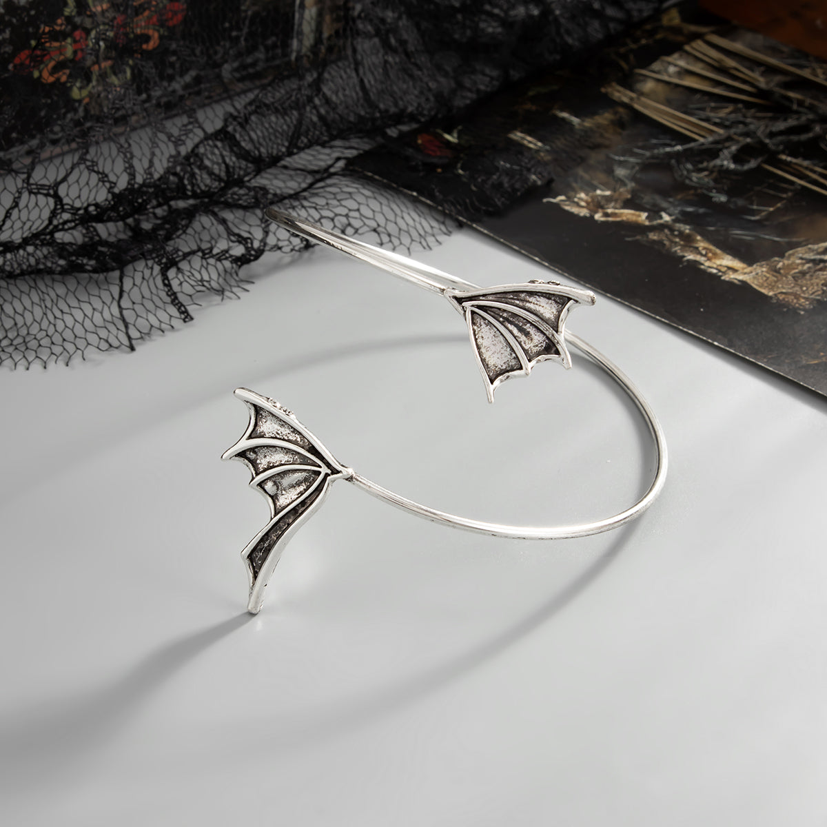 Silvertone Dual Bat Wing Bypass Arm Cuff, botanical inspired, side view