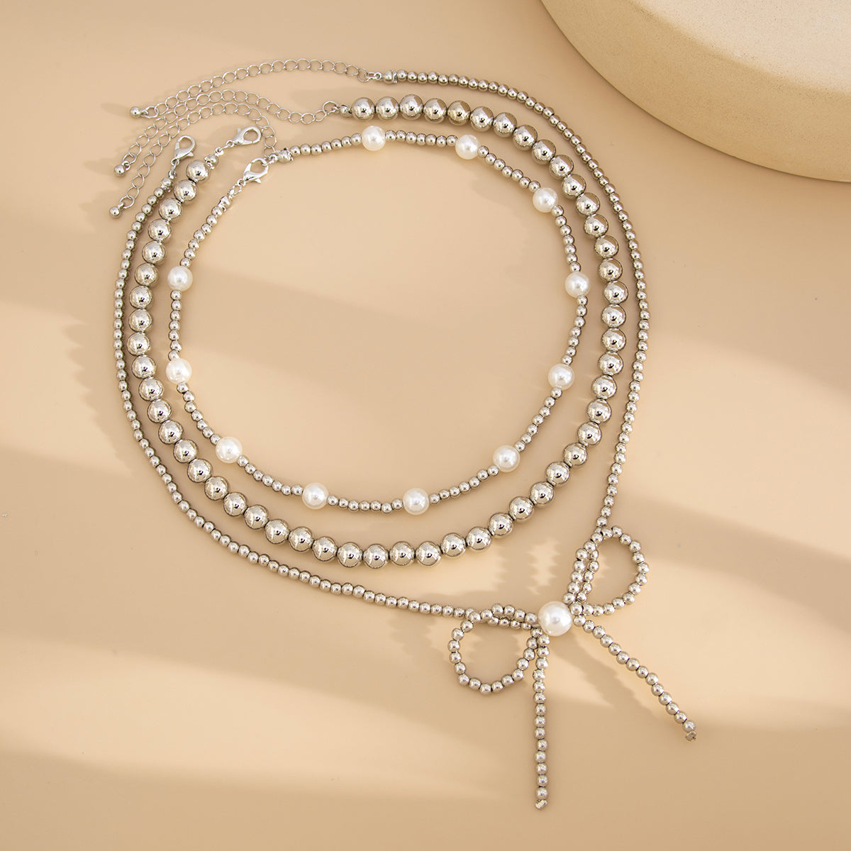 Pearl and Silvertone Beads Chain Bow Pendant Necklace Set, silver pendant necklace for women, side view