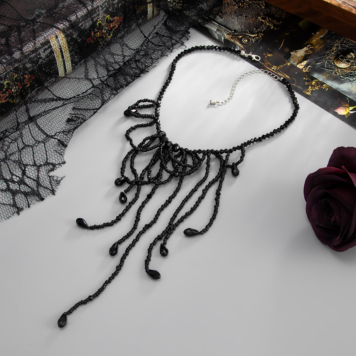 Black Acrylic and Silvertone Tassel Necklace, everyday style, side view