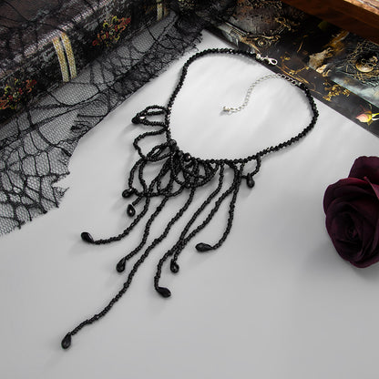 Black Acrylic and Silvertone Tassel Necklace, everyday style, side view
