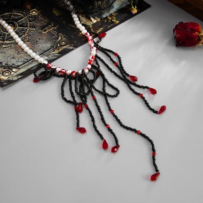Black Acrylic and Enamel Pearl Silvertone Tassel Necklace, botanical inspired, detail close-up