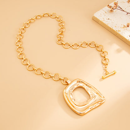 Goldtone ‌Open Trapezium Statement Pendant Necklace, elegant gift for her, detail close-up